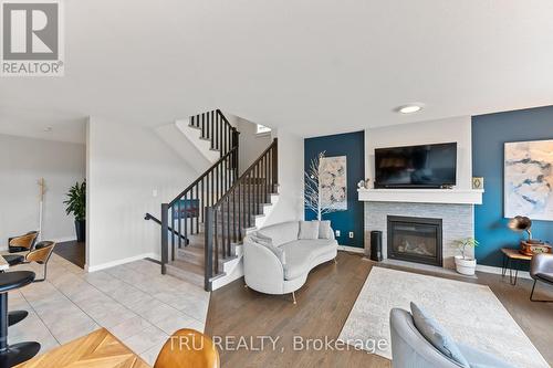 43 Aridus Crescent, Ottawa, ON - Indoor Photo Showing Living Room With Fireplace