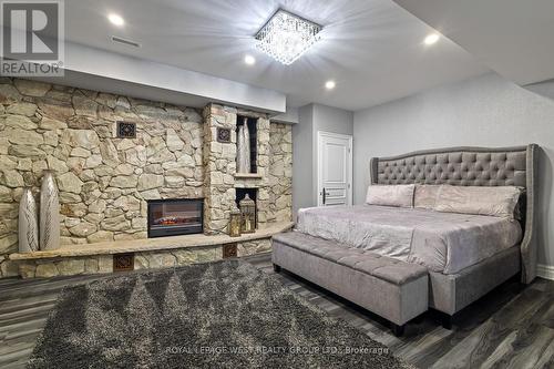 24 Mcarthur Heights, Brampton, ON - Indoor Photo Showing Bedroom With Fireplace