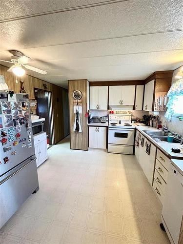103 Manson Street, Mcauley, MB - Indoor Photo Showing Kitchen With Double Sink
