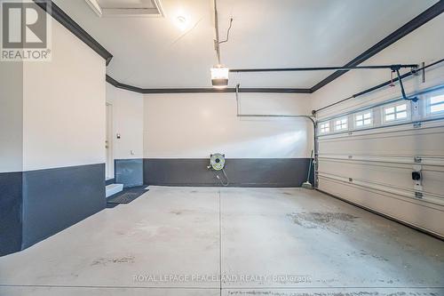 11 - 5595 Drummond Road, Niagara Falls, ON - Indoor Photo Showing Garage
