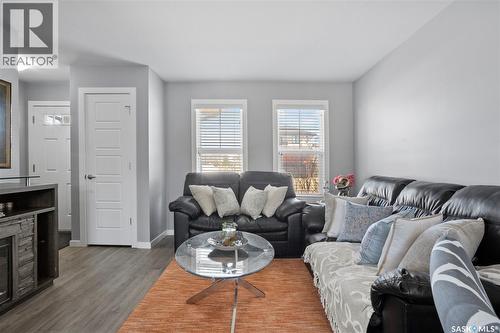 4733 Primrose Green Drive E, Regina, SK - Indoor Photo Showing Living Room With Fireplace