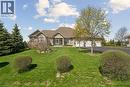 Stone facade residence featuring a multi-gabled roofline and an attached three-car garage - 10 Brolley Crescent, Thornton, ON  - Outdoor With Deck Patio Veranda 
