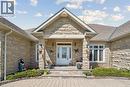 Stone facade entry with a prominent gable roofline - 10 Brolley Crescent, Thornton, ON  - Outdoor 