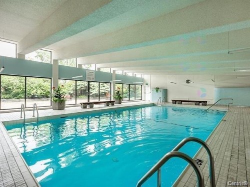 Piscine - 607-1650 Av. Panama, Brossard, QC - Indoor Photo Showing Other Room With In Ground Pool