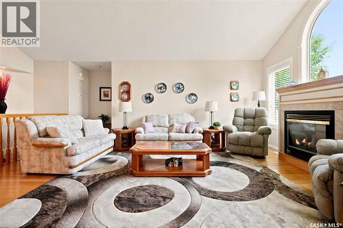 3291 Thames Crescent E, Regina, SK - Indoor Photo Showing Living Room With Fireplace