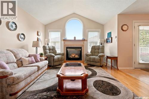 3291 Thames Crescent E, Regina, SK - Indoor Photo Showing Living Room With Fireplace