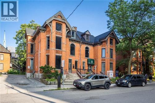 Brick exterior featuring decorative corbels and gables - 189 Hughson Street, Hamilton, ON 