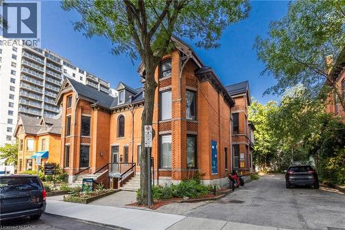 Brick exterior with detailed corbels and architectural window framing - 189 Hughson Street, Hamilton, ON 