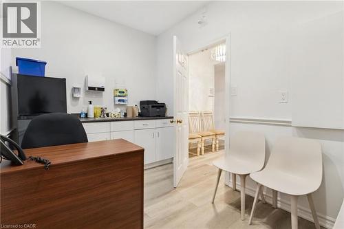 Room #5 -Professionally Equipped/Furnished Office space featuring Door leading to the Wheelchair Accessible Lift. Has a sink and counter-top, and built-in cabinetry and a windows. - 189 Hughson Street, Hamilton, ON 