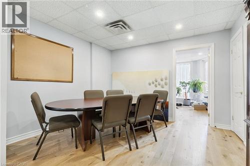 Conference room with recessed lighting illuminates wood-finish flooring and light-toned walls - 189 Hughson Street, Hamilton, ON 