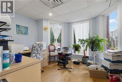 Bright room featuring light wood-finish flooring, recessed lighting, and multiple windows - 189 Hughson Street, Hamilton, ON 