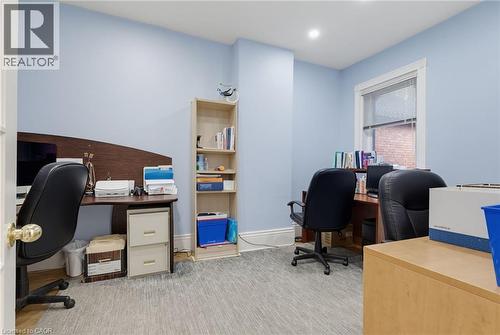 Interior room with light blue walls and a window featuring white trim - 189 Hughson Street, Hamilton, ON 