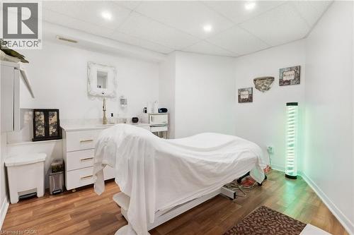 Room with wood-finish flooring and recessed ceiling lighting - 189 Hughson Street, Hamilton, ON 