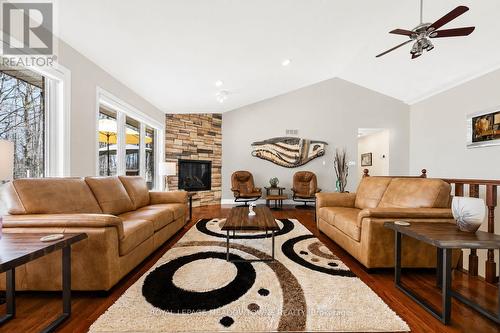 AI generated photo - 834603 4Th Line Ehs, Mono, ON - Indoor Photo Showing Living Room With Fireplace