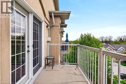 Private balcony featuring a textured concrete surface and metal railings - 