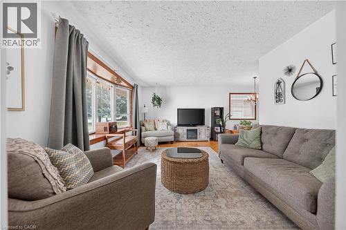Living room featuring neutral wall tones and a textured ceiling - 111 Kimberly Crescent, Kitchener, ON - Indoor Photo Showing Living Room