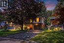 Suburban residence featuring a prominent mature tree, paved driveway, and established landscaping - 356 Coleridge Place, Waterloo, ON  - Outdoor With Facade 