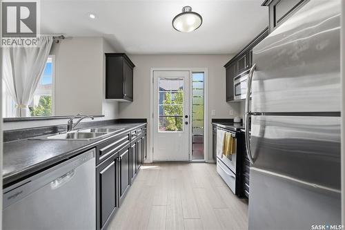 507 150 Langlois Way, Saskatoon, SK - Indoor Photo Showing Kitchen With Double Sink
