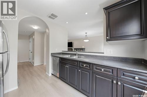 507 150 Langlois Way, Saskatoon, SK - Indoor Photo Showing Kitchen With Double Sink