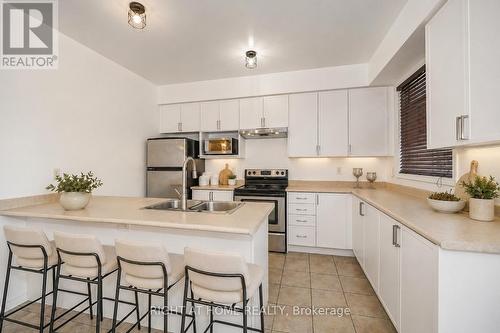 48 Curran Hall Crescent, Toronto, ON - Indoor Photo Showing Kitchen With Stainless Steel Kitchen With Double Sink With Upgraded Kitchen