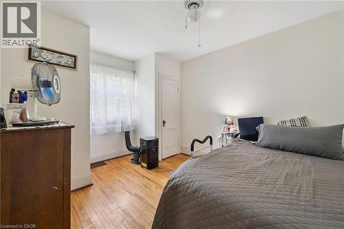 Hardwood flooring throughout, white walls, and a window with natural light - 95 Forest Road, Cambridge, ON - Indoor Photo Showing Bedroom