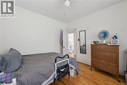 Hardwood flooring throughout, white walls, and a ceiling-mounted light fixture - 95 Forest Road, Cambridge, ON - Indoor Photo Showing Bedroom