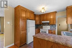 Kitchen with easy access to the rear deck and backyard. - 