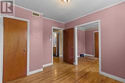 Comfortable primary bedroom with ample natural light. - 