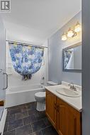 Main floor bathroom conveniently located near all bedrooms. - 
