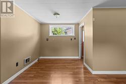 Spacious recreation room perfect for family movie nights or entertaining. - 