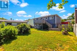 Generous backyard with plenty of room to relax, play, or garden. - 