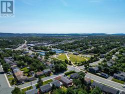 Aerial view highlighting nearby parks and amenities. - 