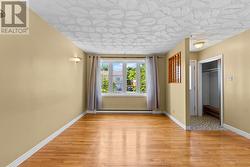 Spacious living room ideal for everyday living and entertaining. - 