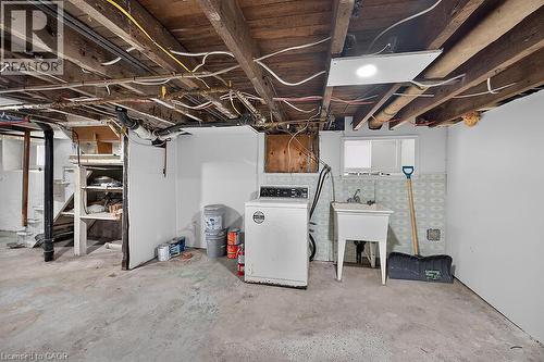 Concrete flooring with exposed ceiling joists and utility piping - 103 Mary Street, Hamilton, ON - Indoor Photo Showing Basement