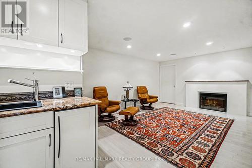 rec rm w/beverage counter, fridge & ice marker - 2009 Killarney Drive, Ottawa, ON - Indoor With Fireplace