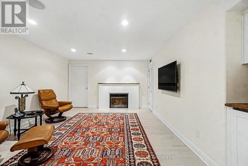 Rec room w/heated flr & fireplace - 2009 Killarney Drive, Ottawa, ON - Indoor With Fireplace