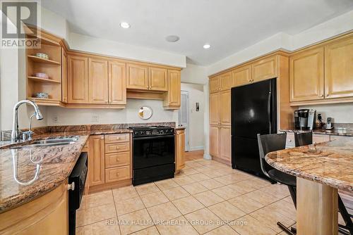 Granite counters & tile floor - 2009 Killarney Drive, Ottawa, ON - Indoor Photo Showing Kitchen With Double Sink