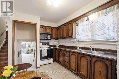 229 East 8Th Street, Hamilton, ON - Indoor Photo Showing Kitchen With Double Sink