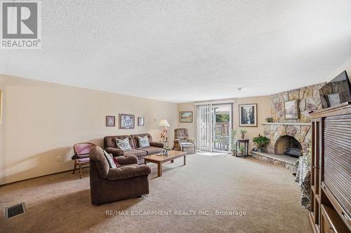 229 East 8Th Street, Hamilton, ON - Indoor Photo Showing Living Room With Fireplace