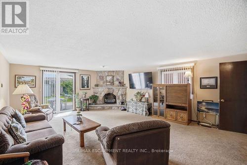 229 East 8Th Street, Hamilton, ON - Indoor Photo Showing Living Room With Fireplace