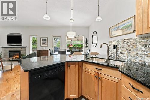 111 655 Kenderdine Road, Saskatoon, SK - Indoor Photo Showing Kitchen With Fireplace