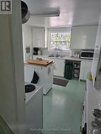 Kitchen view from the stairs to go up - 