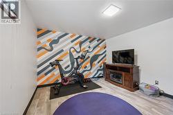 Dedicated fitness space with wood-finish flooring - 