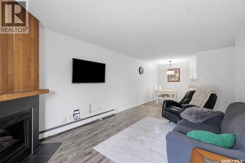 717 310 Stillwater Drive, Saskatoon, SK - Indoor Photo Showing Living Room With Fireplace