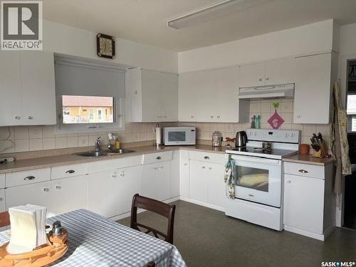 211 Throne Street, Sceptre, SK - Indoor Photo Showing Kitchen With Double Sink