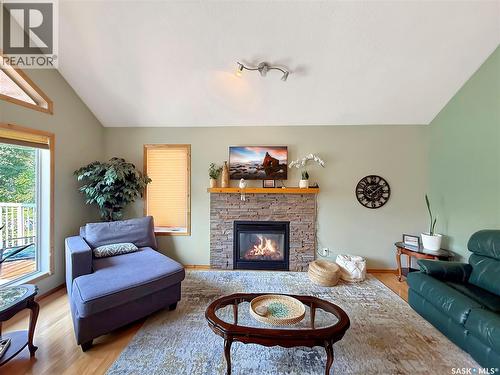 10 Sunset Way, Candle Lake, SK - Indoor Photo Showing Living Room With Fireplace