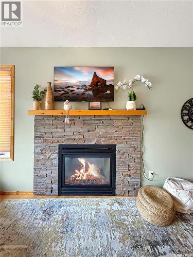 10 Sunset Way, Candle Lake, SK - Indoor Photo Showing Living Room With Fireplace