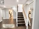 Staircase with wood-finish treads and risers, featuring a light wood handrail - 90 Arlington Boulevard Unit# Bsmt, Kitchener, ON  - Indoor Photo Showing Other Room 