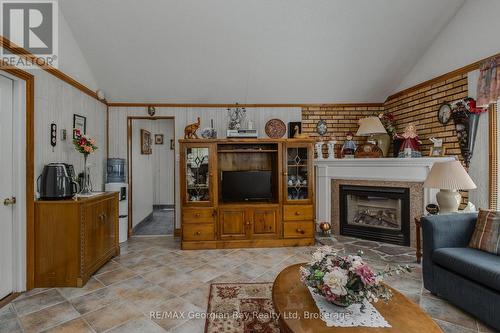 3 Brookside Drive, Tiny, ON - Indoor Photo Showing Living Room With Fireplace
