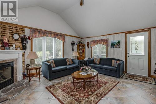 3 Brookside Drive, Tiny, ON - Indoor Photo Showing Living Room With Fireplace
